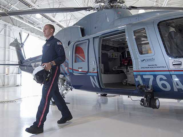 Medical helicopter and service professional in foreground