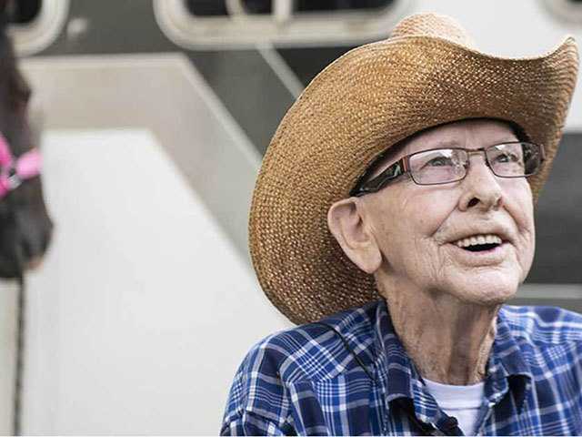 Senior man wearing a cowboy hat.