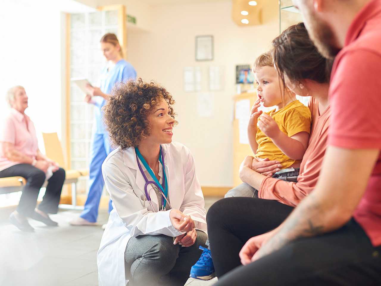 Healthcare provider talking to family.
