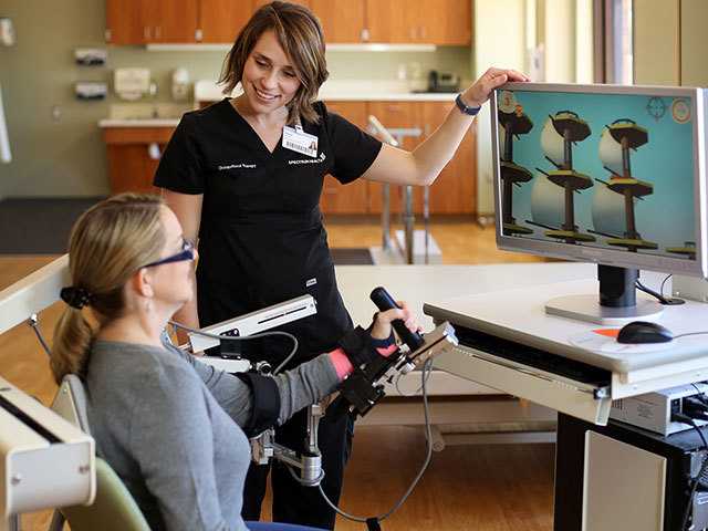 Patient receiving walking assistance down stairs