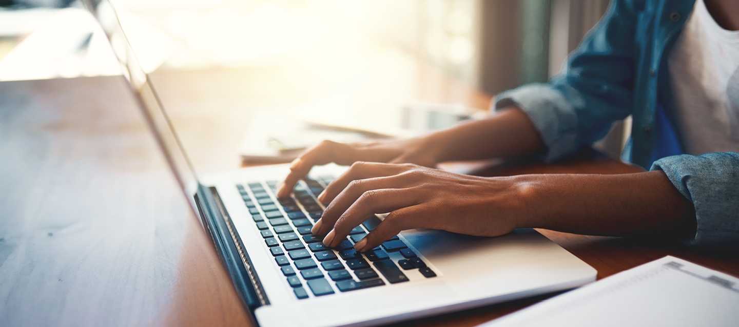 hands at a laptop keyboard